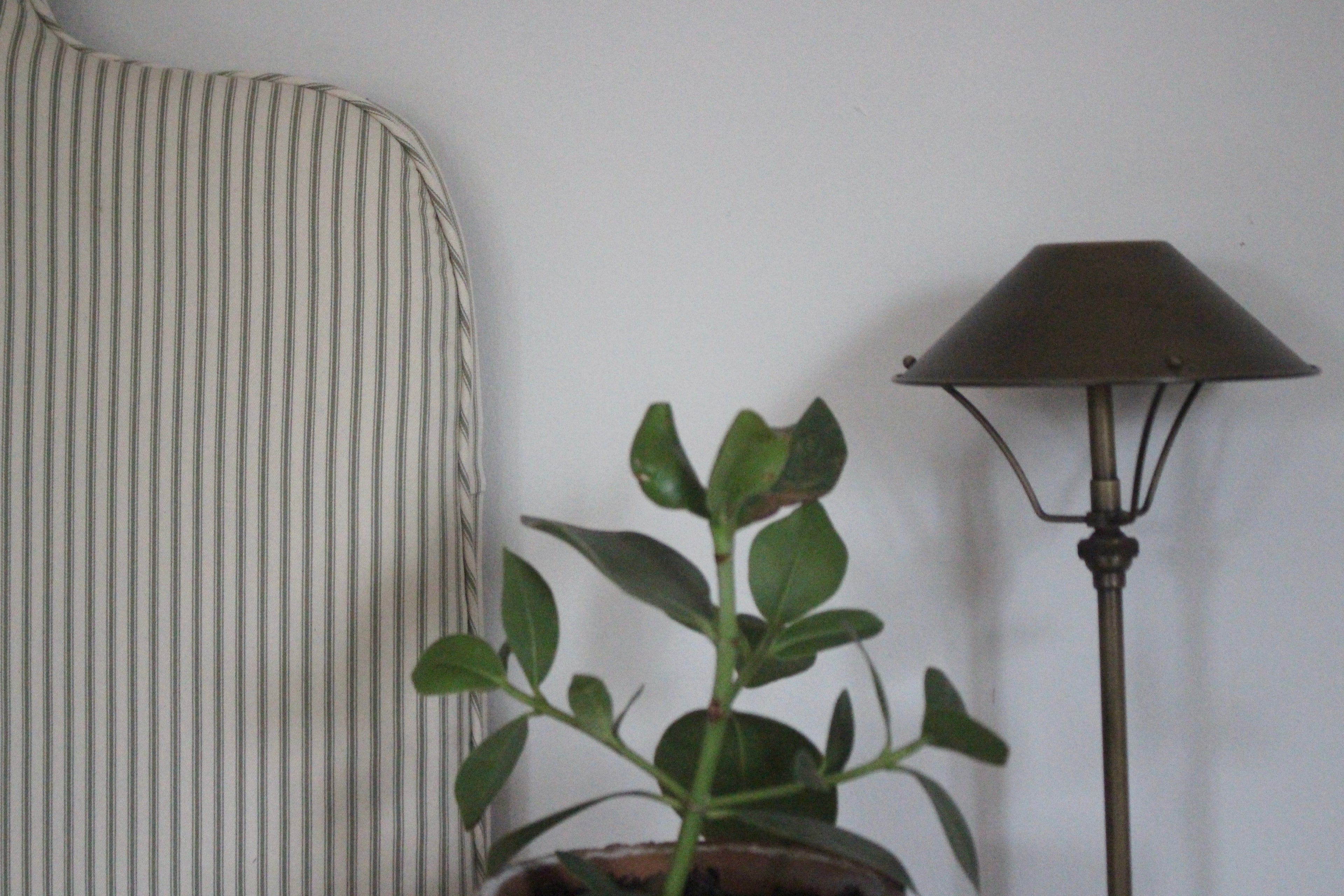 Close-up of Ian Mankin sage stripe upholstery on handmade Pippa headboard