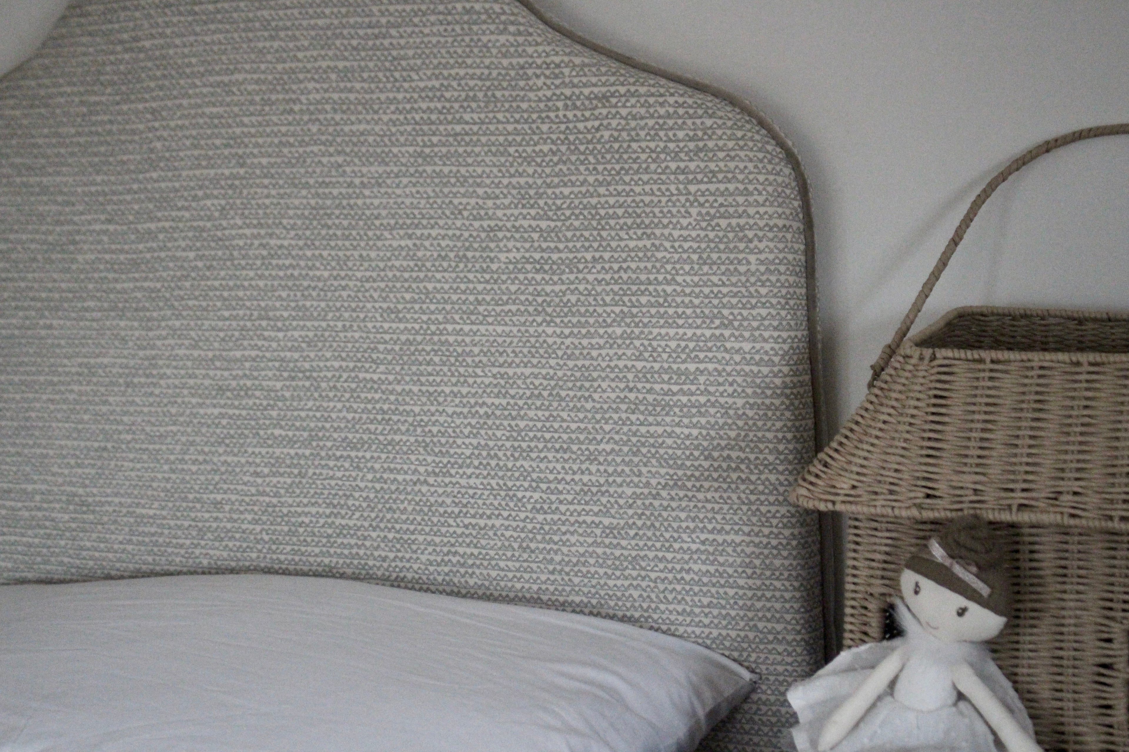 Close-up of Fermoie designer fabric on handmade Margot single headboard